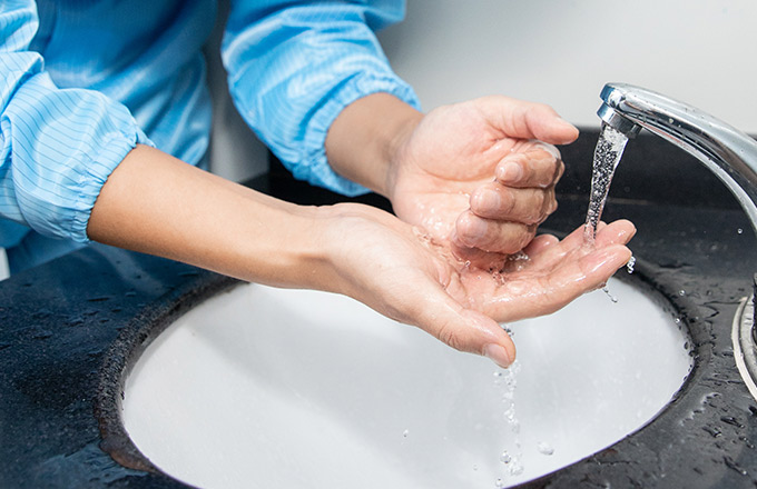 A worker is washing hands