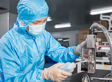 A worker is cleaning ink jet printer