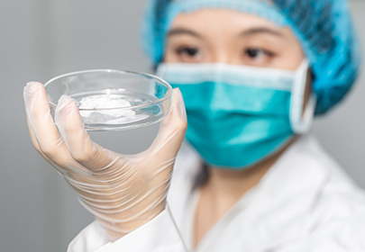 A researcher is checking the microbial test results